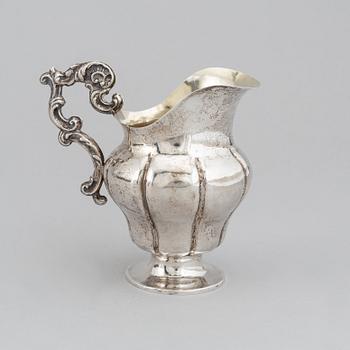 A Swedish 19th century parcel-gilt silver cream-jug, mark of Oskar Ahlström, Södertälje 1856.