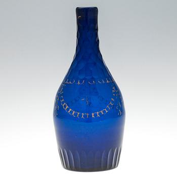 A DECANTER. Blue glass, partially cut and gilted decoration. Russia, early 1800s.