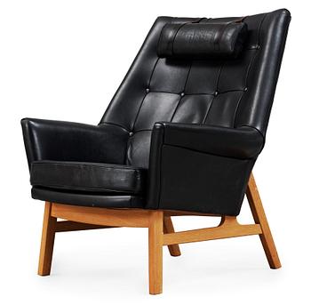 101. A Tove & Edvard Kindt- Larsen 'Glimminge' oak and black leather armchair, 1960's.
