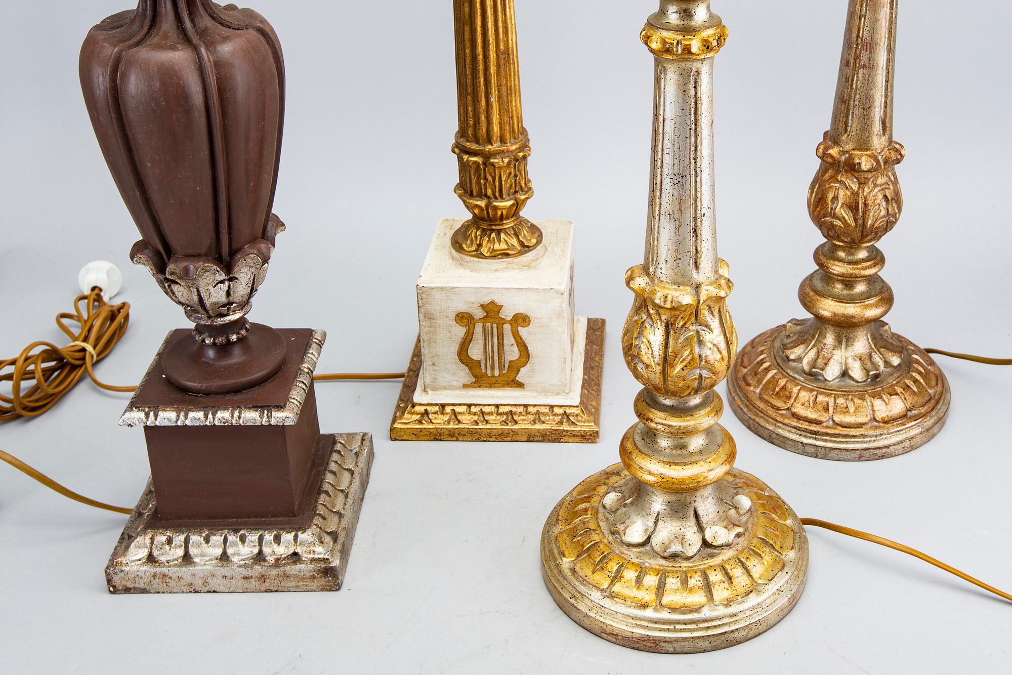 Four mid 20th century wood table lamps from Paoletti, Firenze Italy.