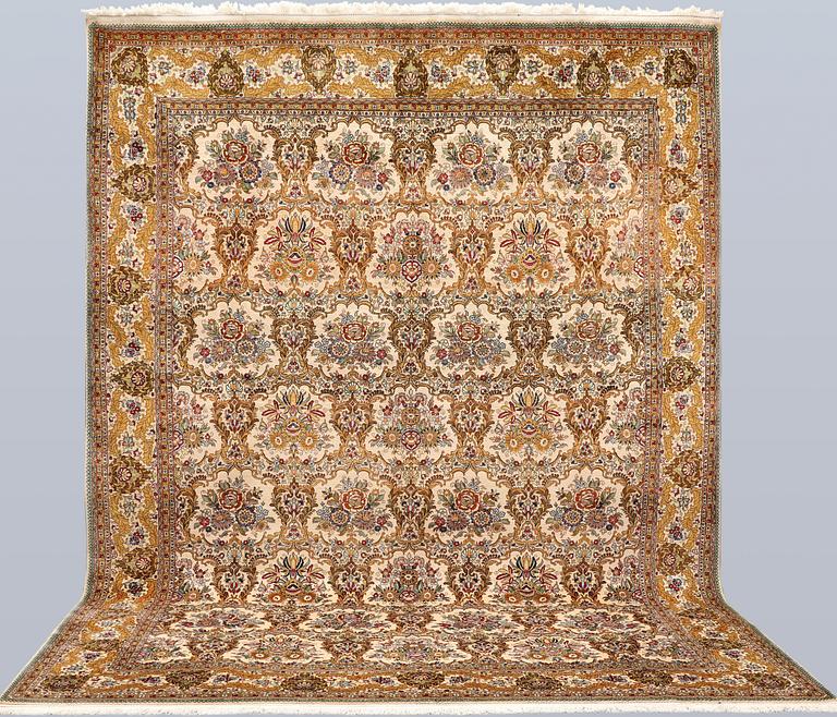 A part silk Ghom carpet, c. 420 x 310 cm.