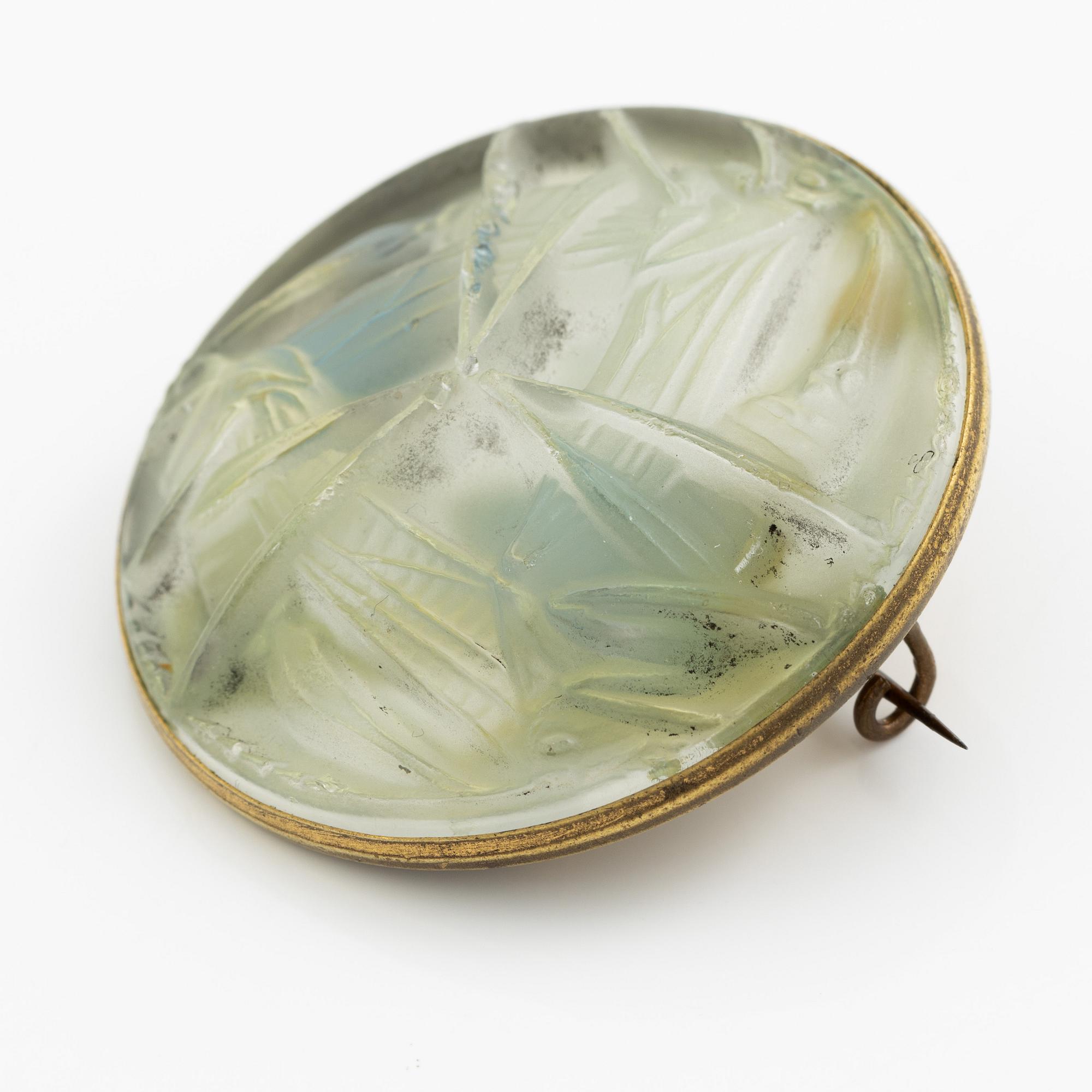 René Lalique, a brooch, glass, with a motif of crickets.