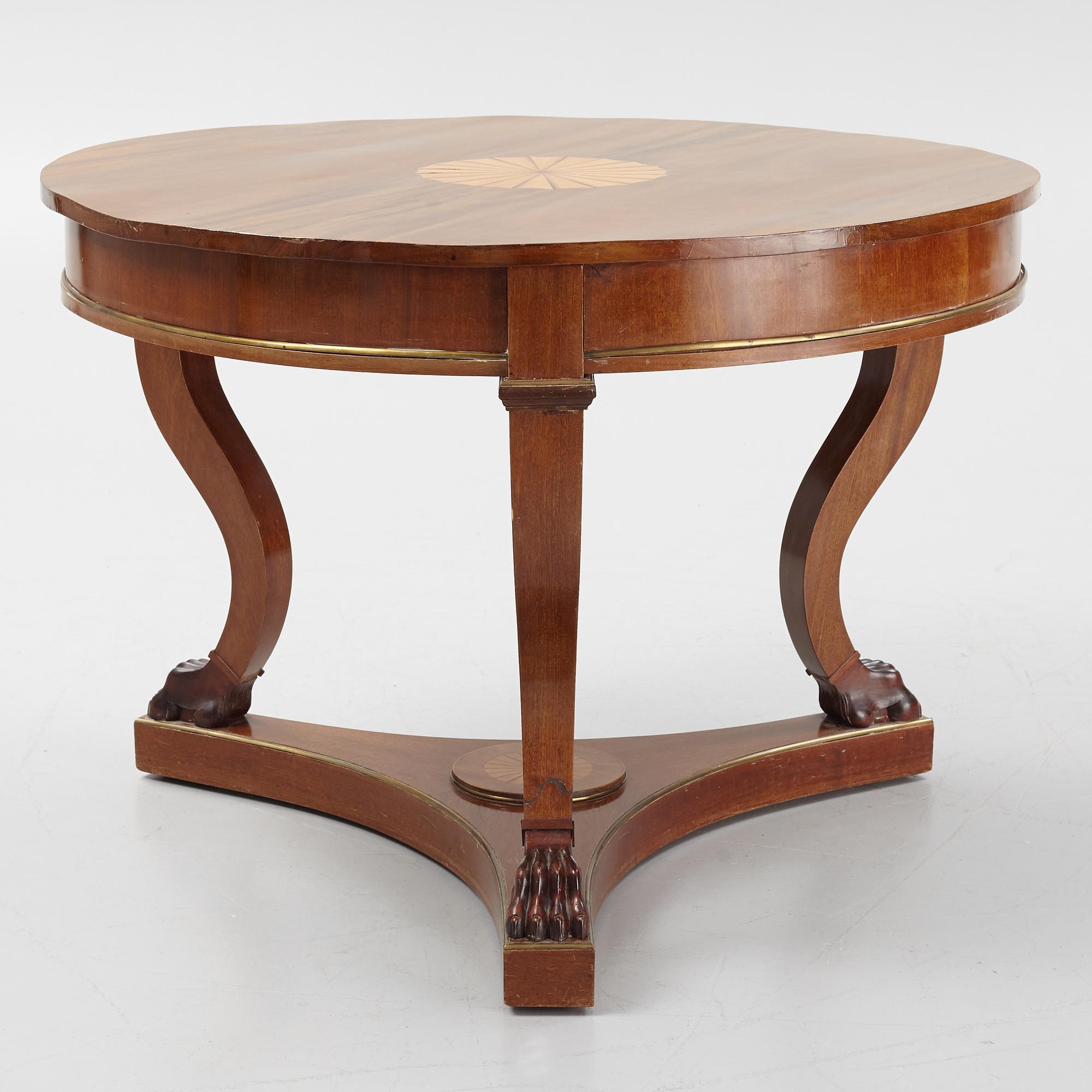 A mahogany veneered Empire style table, first half the 20th Century.