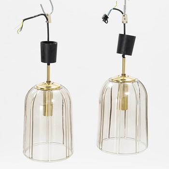 A pair of glass and brass ceiling lights, Glashütte Limburg, Germany.