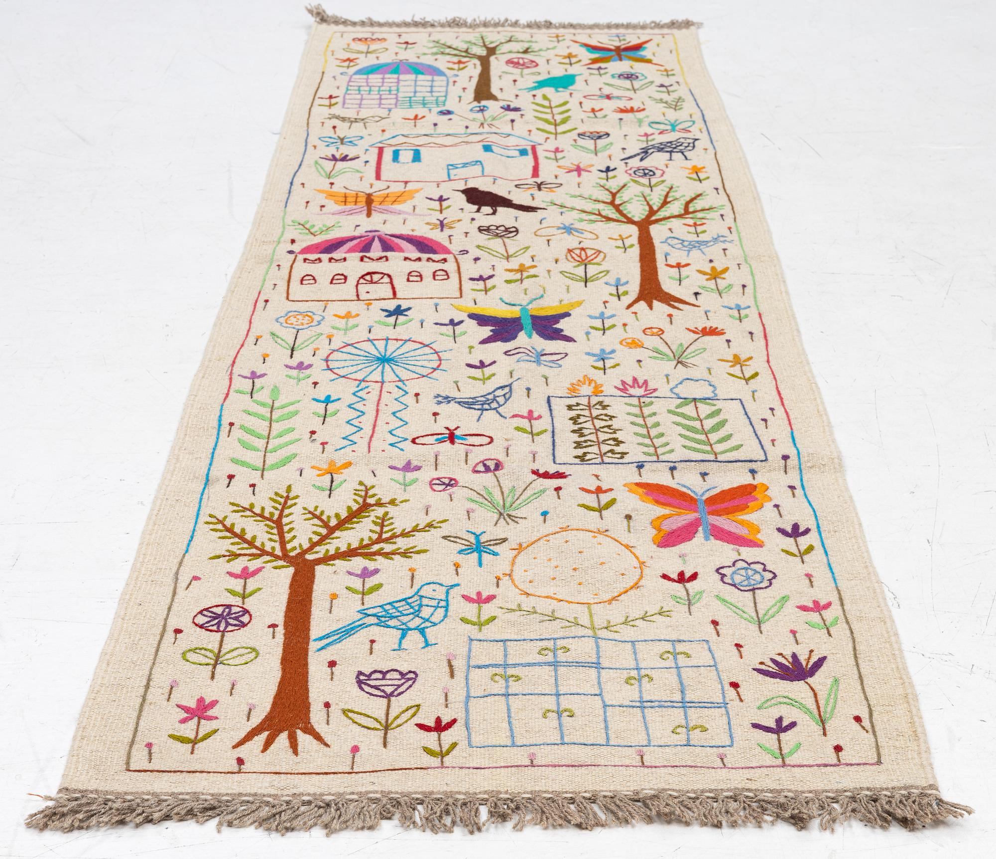 A hand-embroidered Kelim runner, c. 292 x 85 cm.