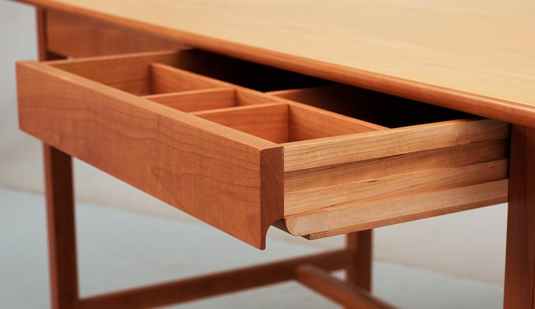 A Josef Frank ash and mahogany desk with brass fittings, by Svenskt Tenn.
