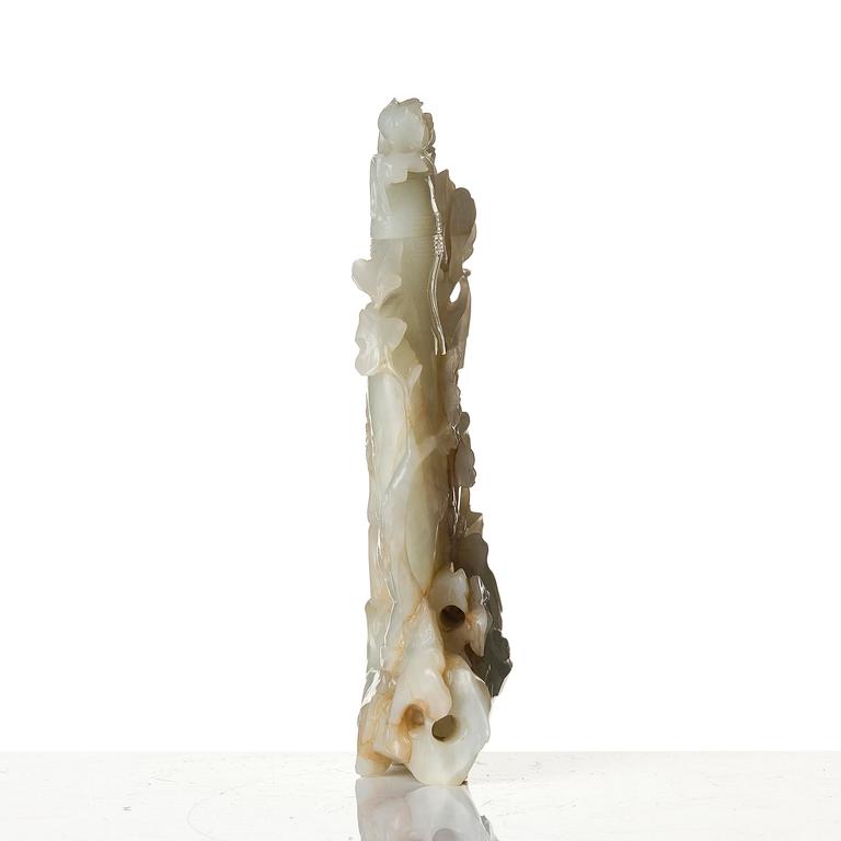 A well sculptured pale green and russet coloured nephrite vase with cover, 20th century.