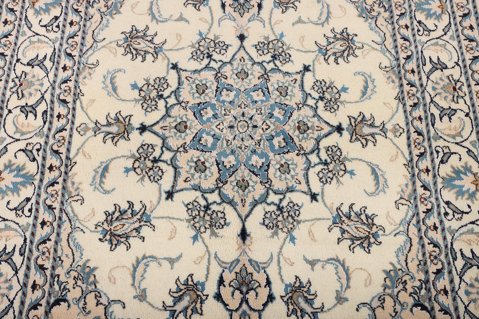 A Nain part silk rug, c. 193 x 148 cm.