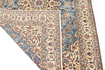 A Nain, part silk carpet, c. 196 x 120 cm.