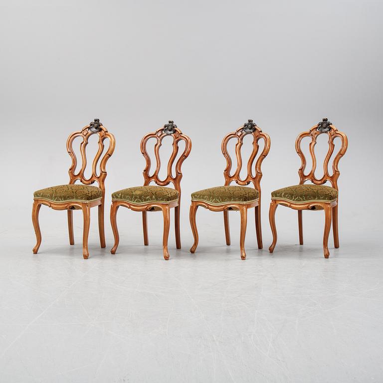 A rococo style sofa, four chairs and a table, second half of the 19th Century.
