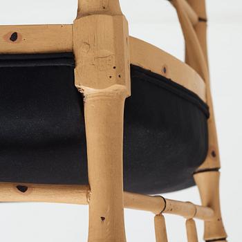 A pair of late Gustavian bamboo imitation armchairs by Ephraim Ståhl, master in Stockholm 1794-1820.