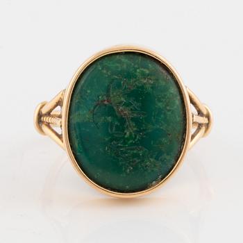 Green carved stone ring.
