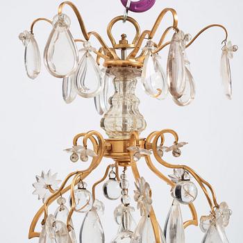 A Louis XV-style rock crystal eight-light chandelier, 20th century.