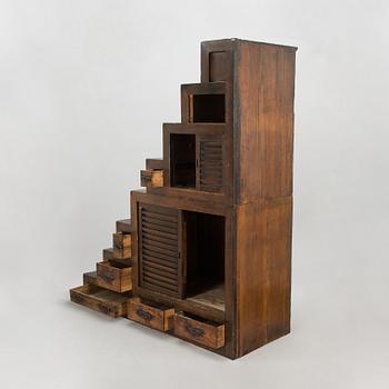 A Japanese chest of drawers / cabinet so-called "Step Tansu" in cedar wood, 19th century.