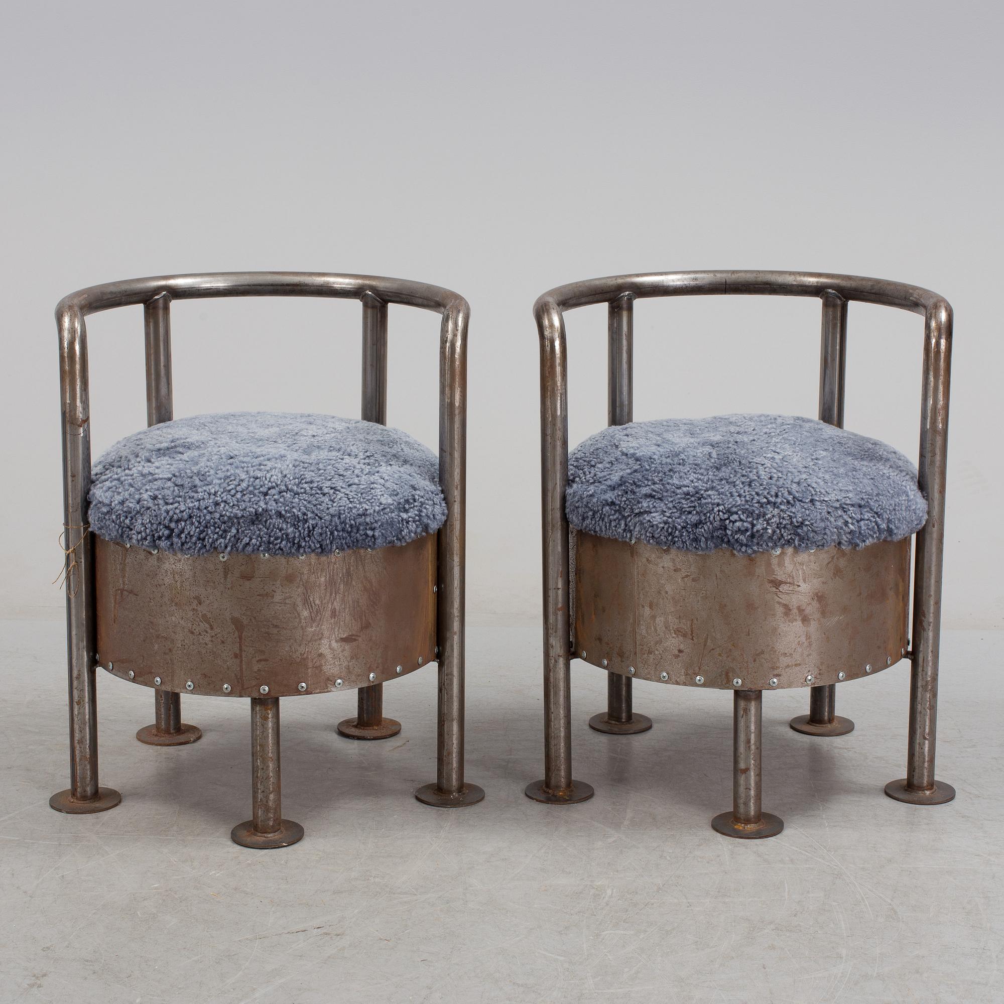 A pair of steel chairs by Arpad Földessy, 21st Century.