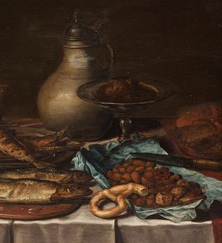 Pieter Claesz Circle of, Still life with fish, bread and jars.