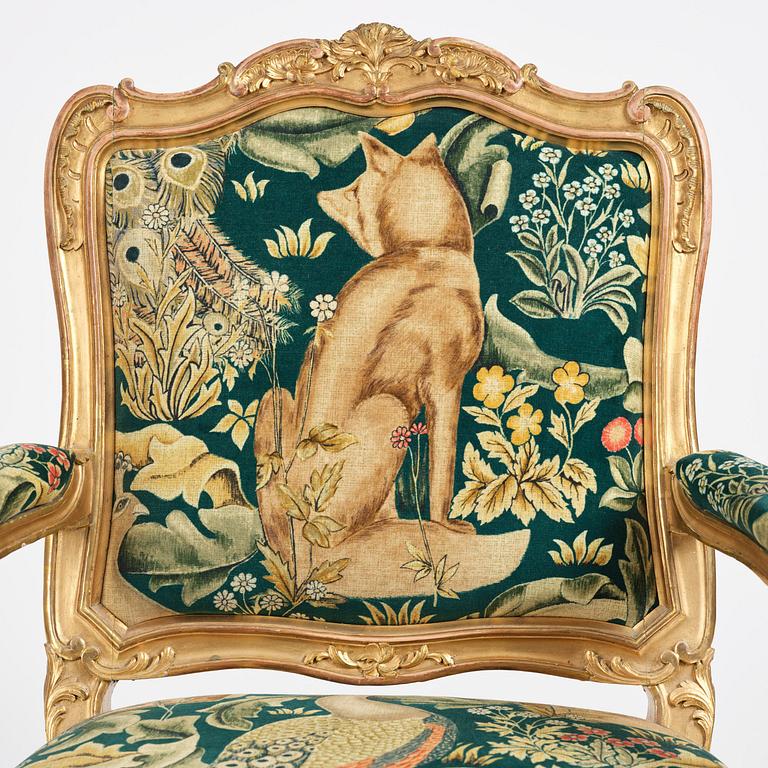 A pair of Louis XV-style giltwood fauteuils, late 19th century.