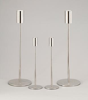 A set of four stainless steel candle sticks 'Noster', by Jonas Lindvall Skandiform.