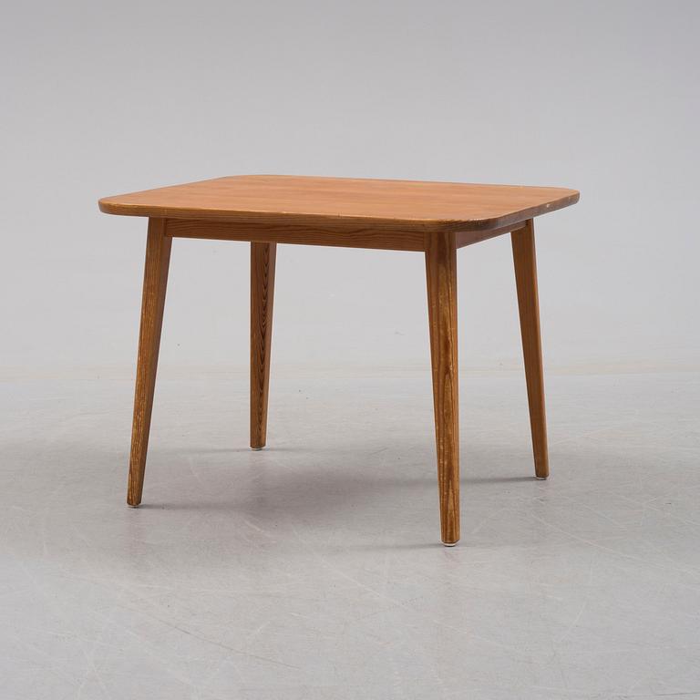 A pine table by Carl Malmsten, late 20th century.