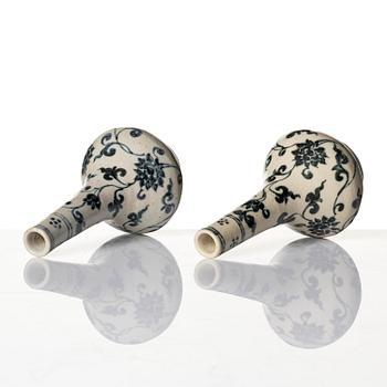 A pair of blue and white lotus vases/water sprinklers, Ming dynasty (1368-1644).