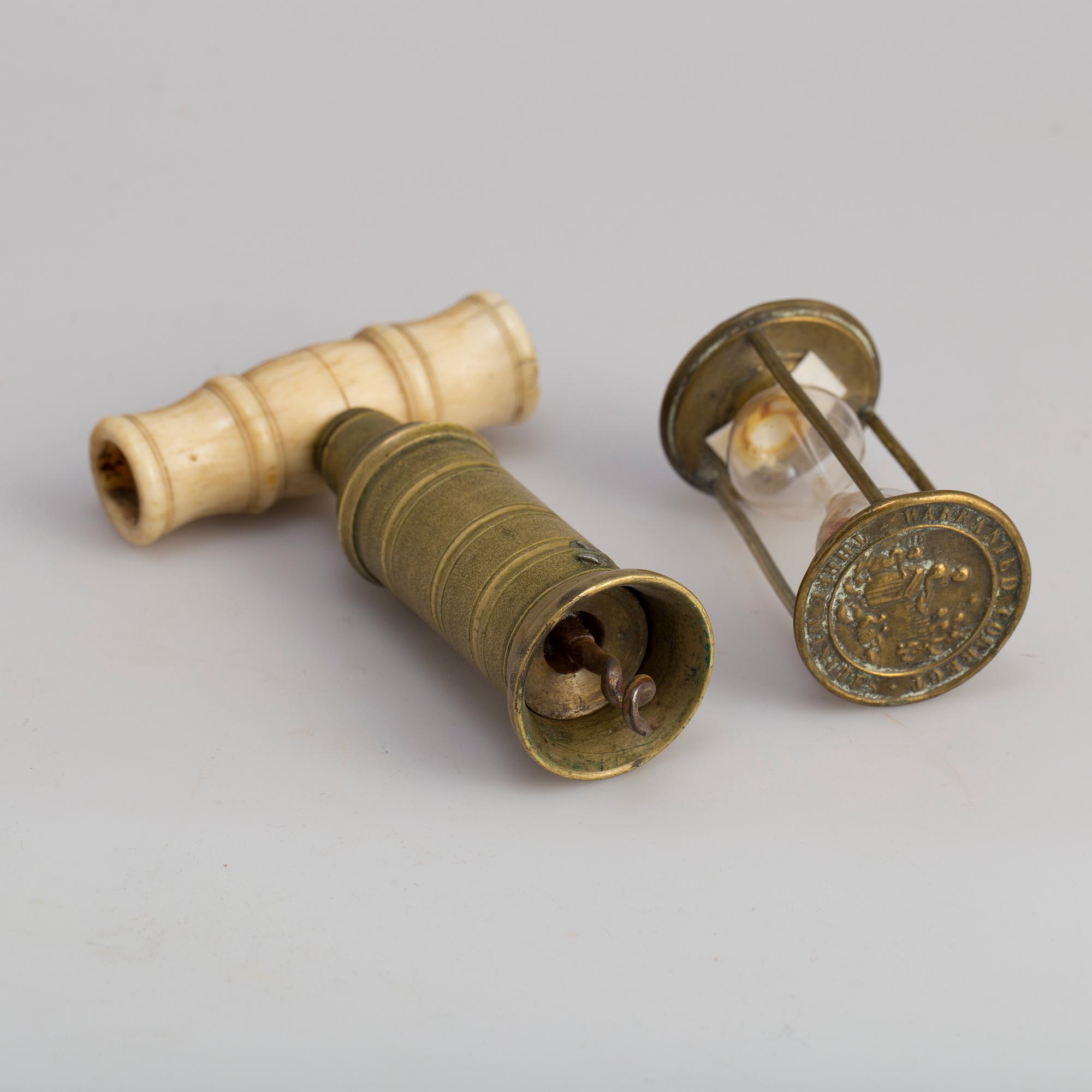 A brass cork screw and hourglass 19th century.