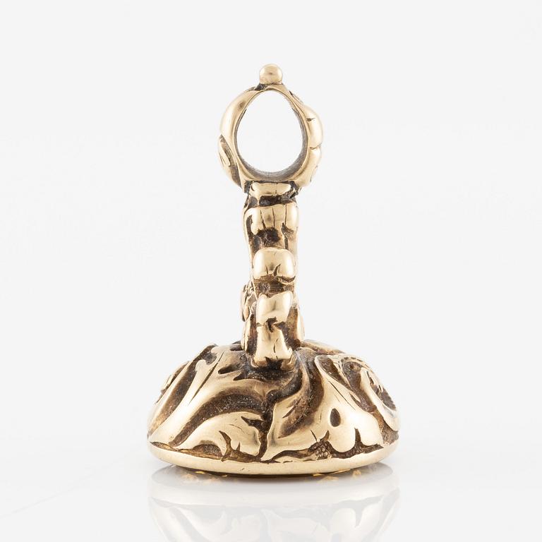 Sigill 14K guld och graverad gulaktig sten, möjligen citrin.