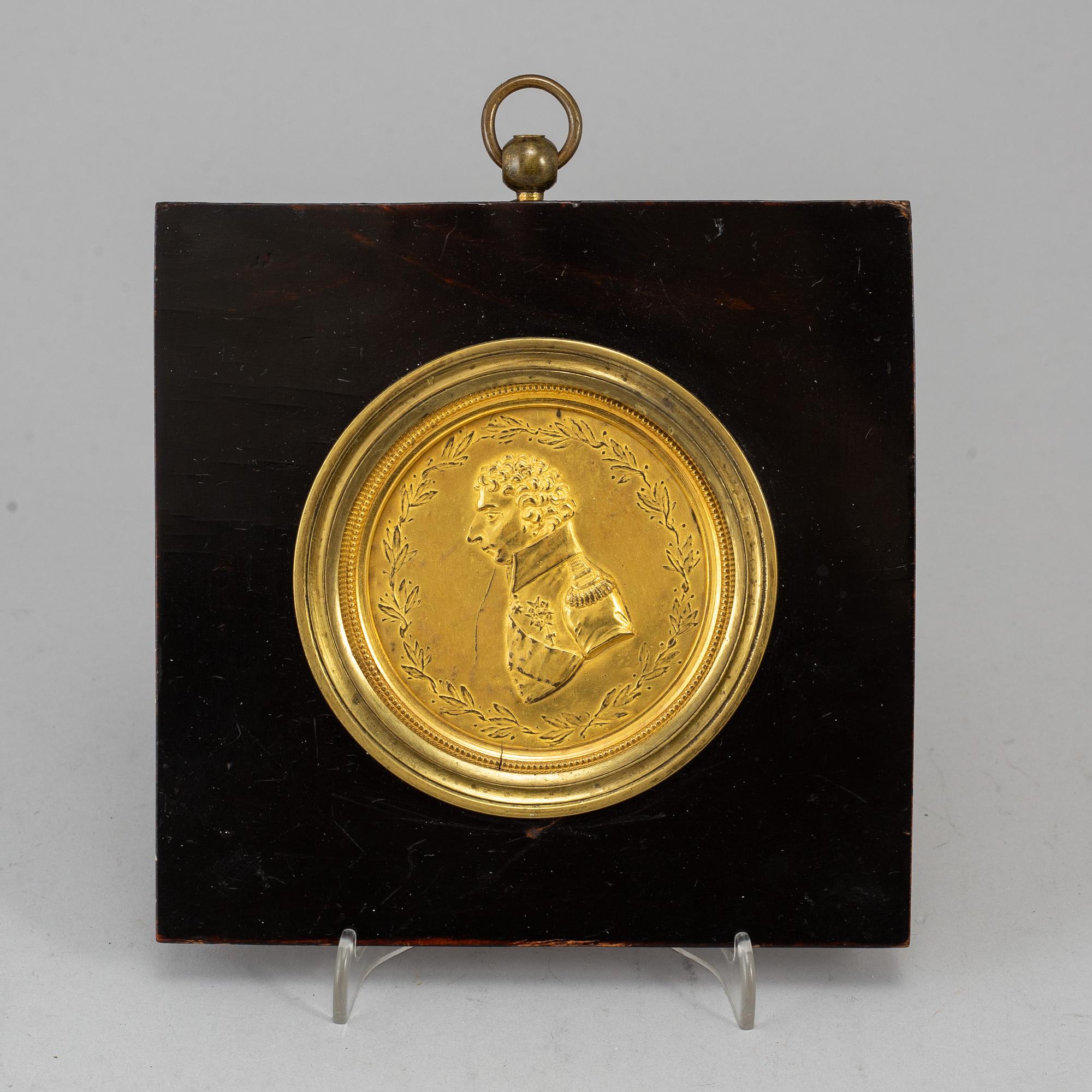 A gilt brass medalion, early 19th century.