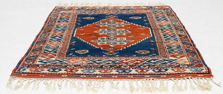 A semi-antique Turkish rug, 175 x 123 cm.