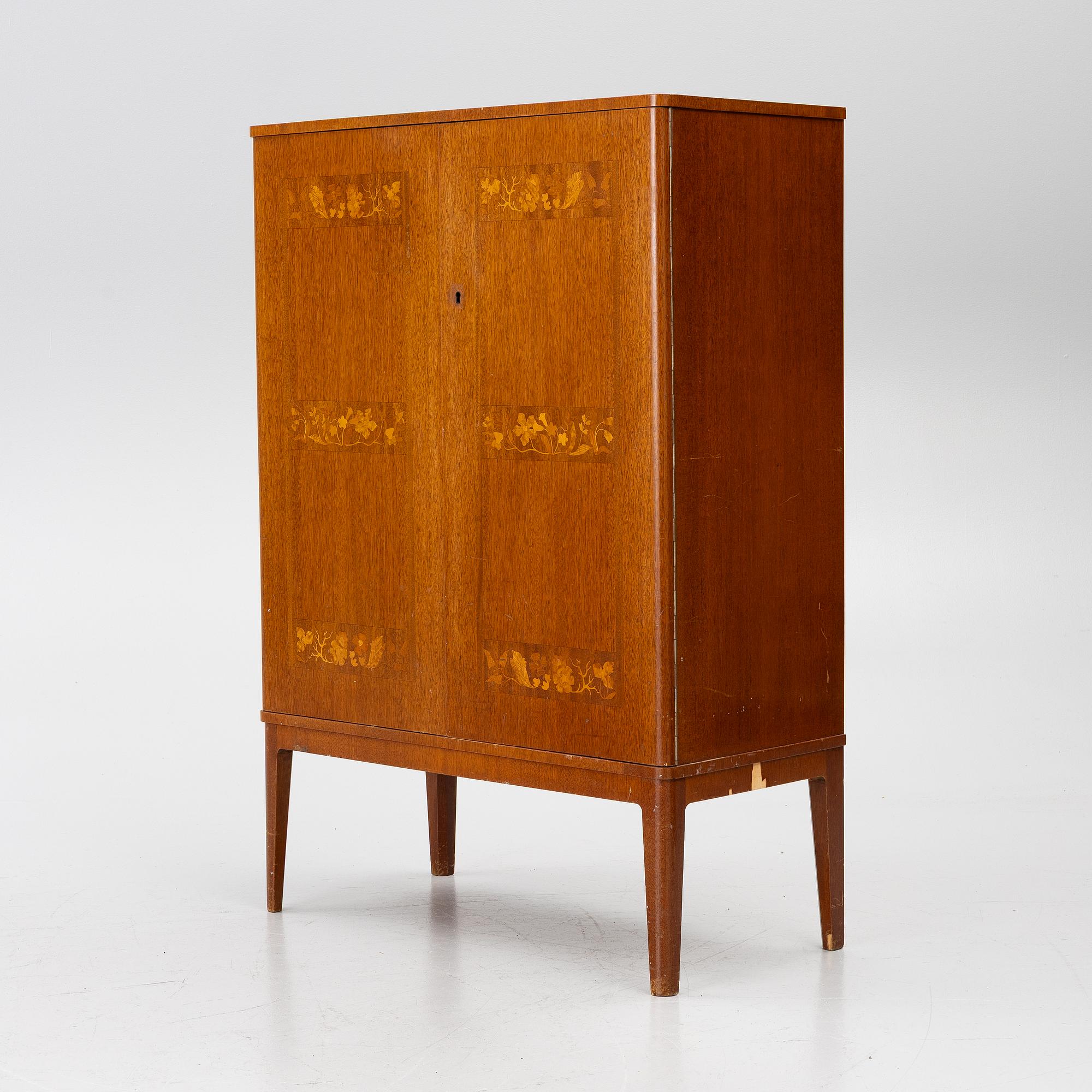 A Swedish Modern cabinet, 1940s.