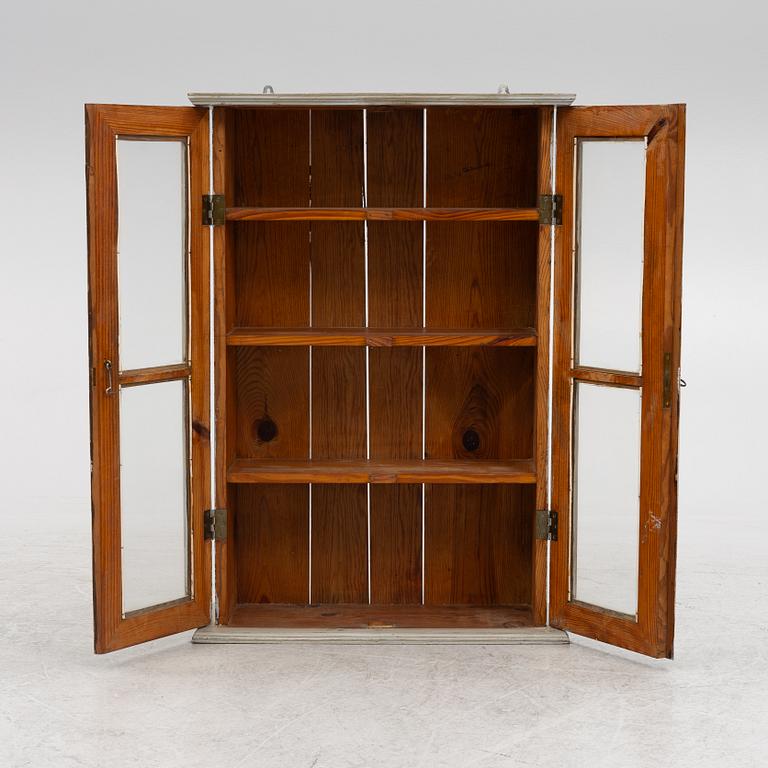 A wall cabinet, around 1900.