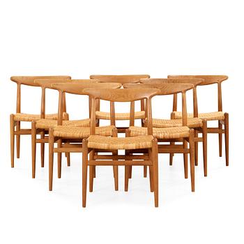 64. Hans J. Wegner, A set of eight oak chairs by Carl Madsen, Denmark 1950-60's.