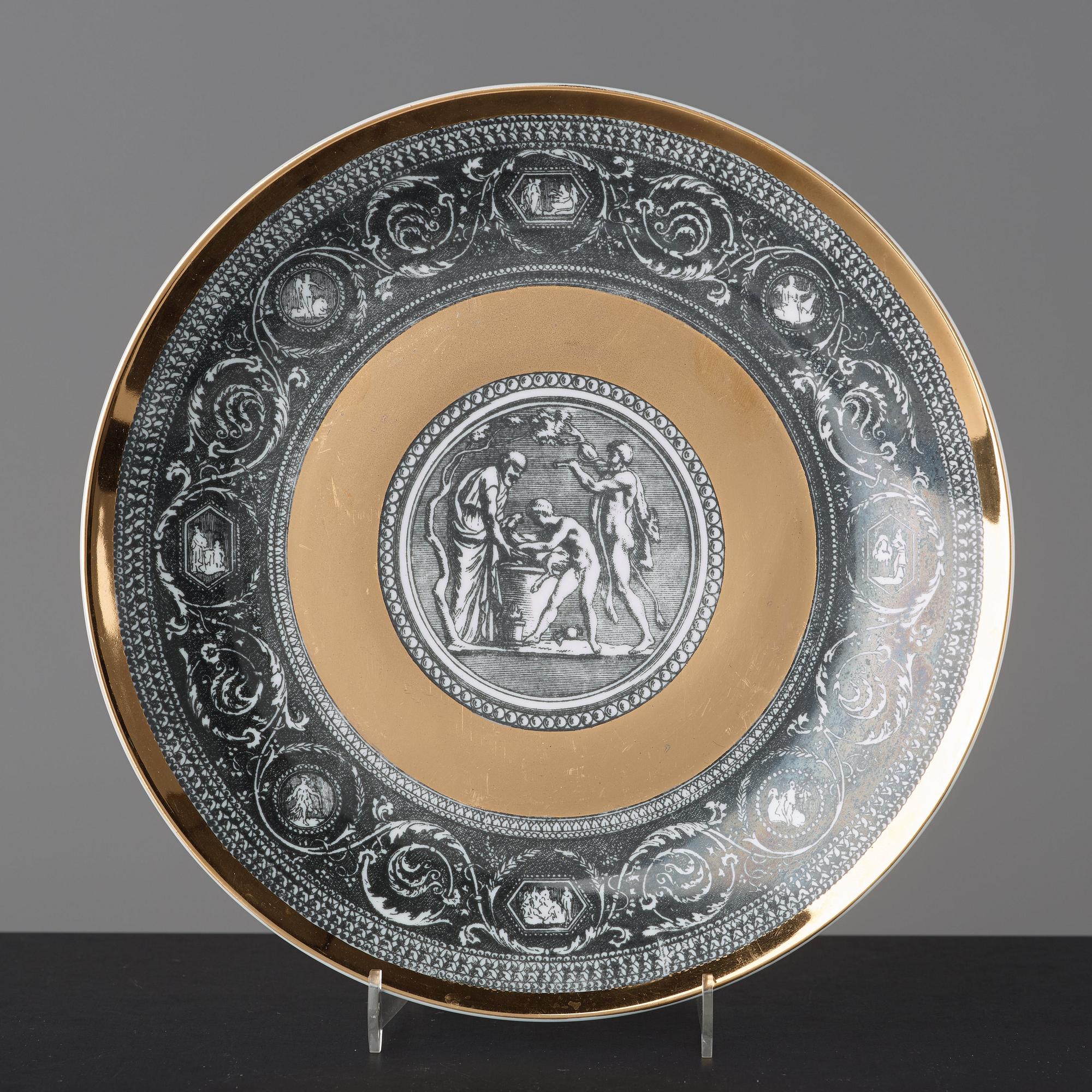 Piero Fornasetti, a set of six "Cammei" porcelain plates, Milano, Italy.