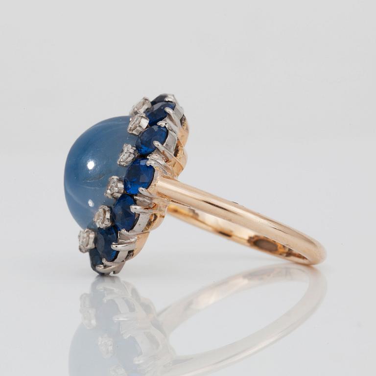 An untreated 10.60 ct star sapphire, brilliant-cut diamond and fancy cut sapphire ring.