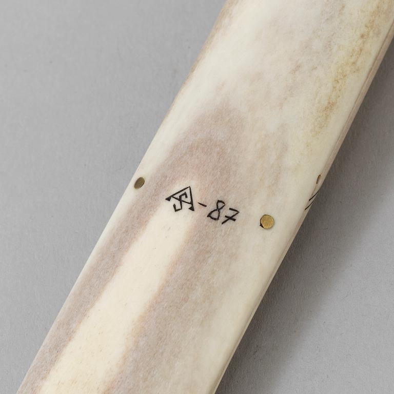 A Sami knife, reindeer horn, signed AS and dated -87.