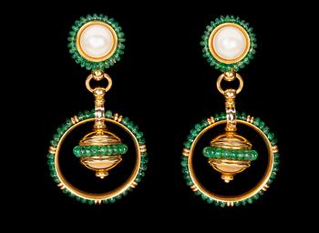 1071. A pair of emerald and mabe pearl earrings.