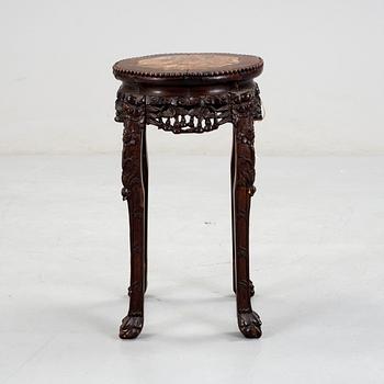 A hardwood table with marble top, China, 20th Century.