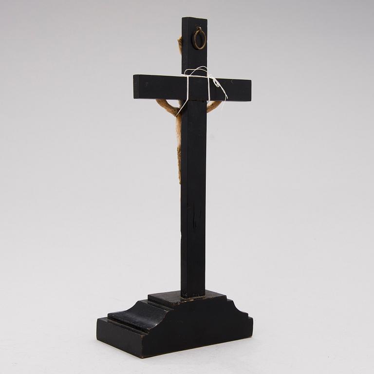 A WOODEN AND BONE TABLE CRUCIFIX with base. 19th Century.