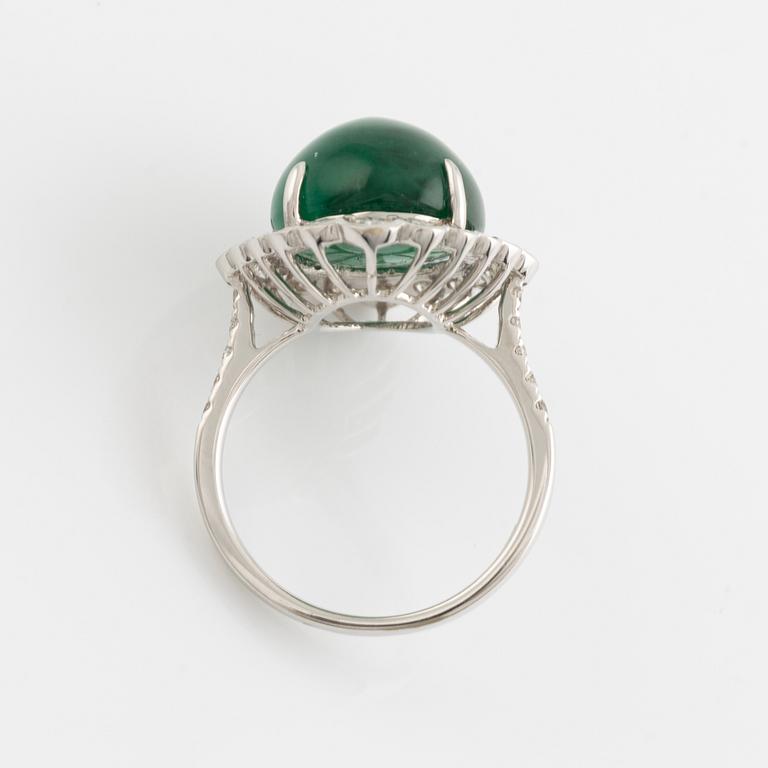 Cabochon cut emerald and brilliant cut diamond ring.