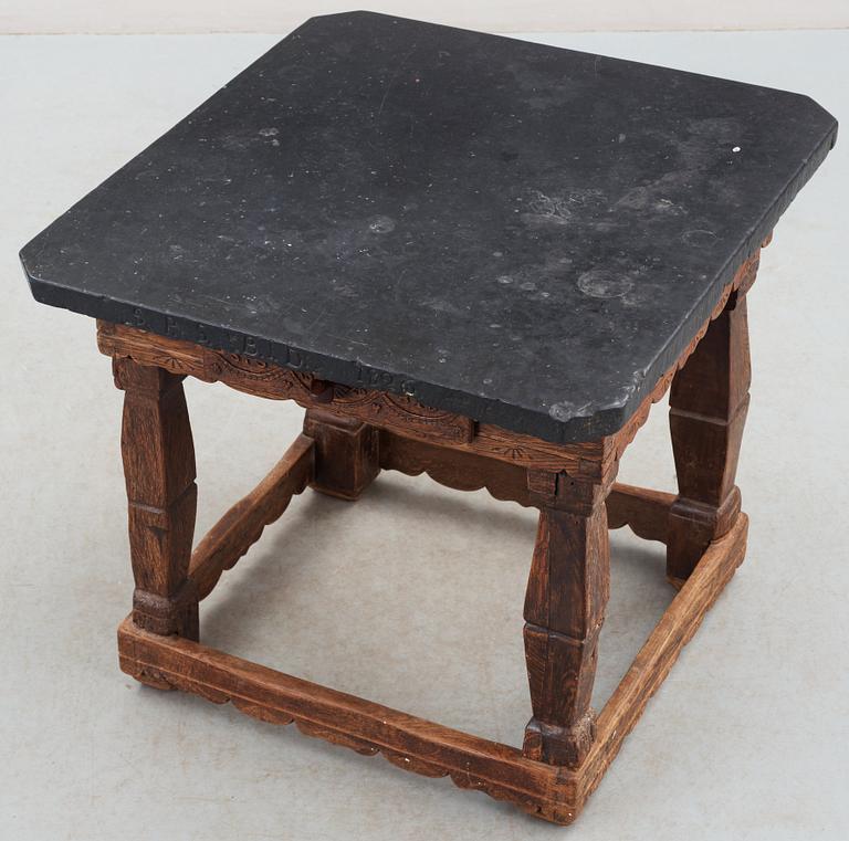 A Swedish stone top table dated 1826.