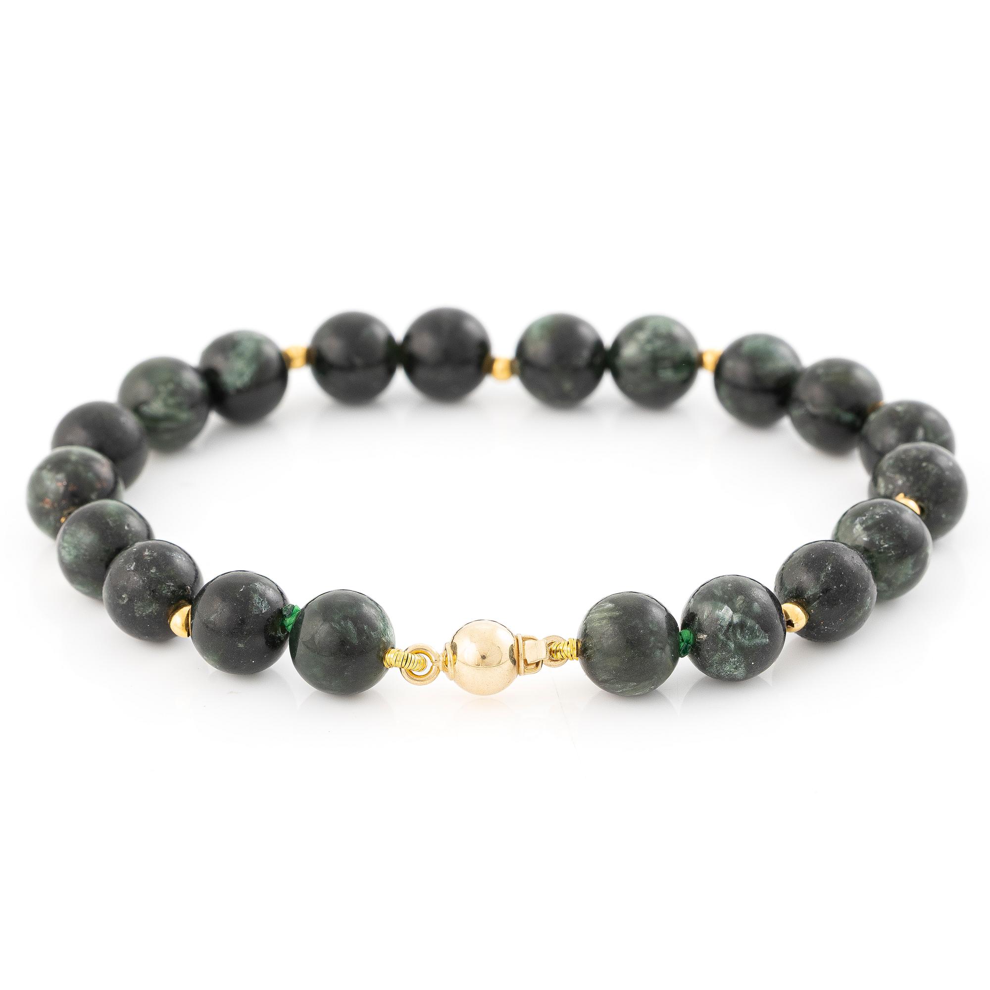 Bracelet, with dark green stones, clasp in 18K gold.