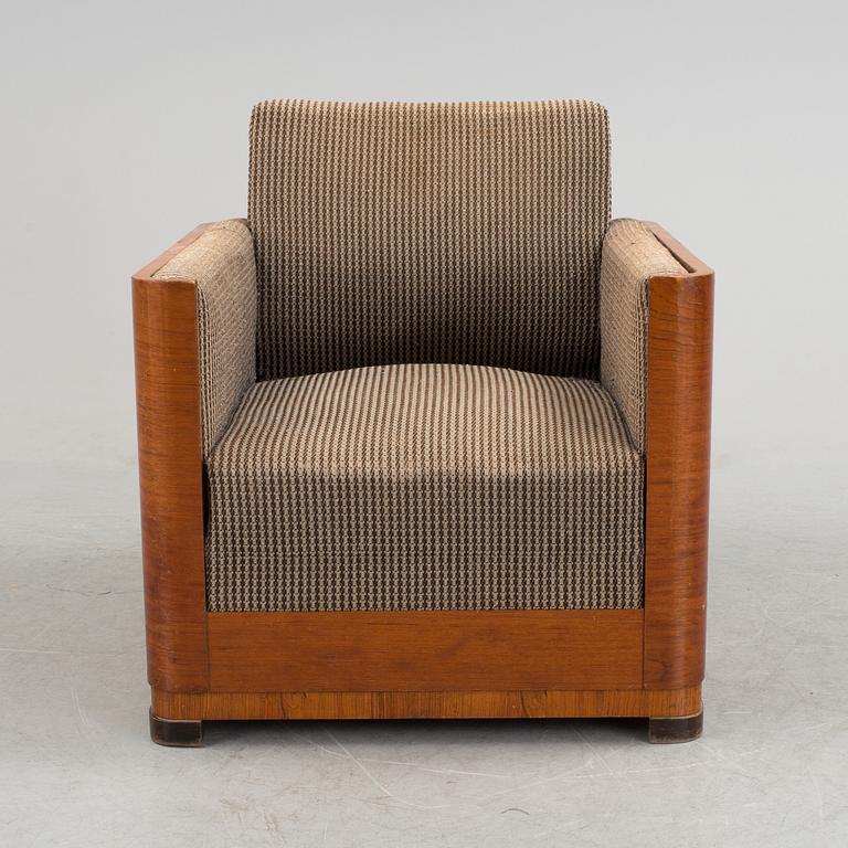 An Art Deco armchair veneered with walnut from the 1930's.