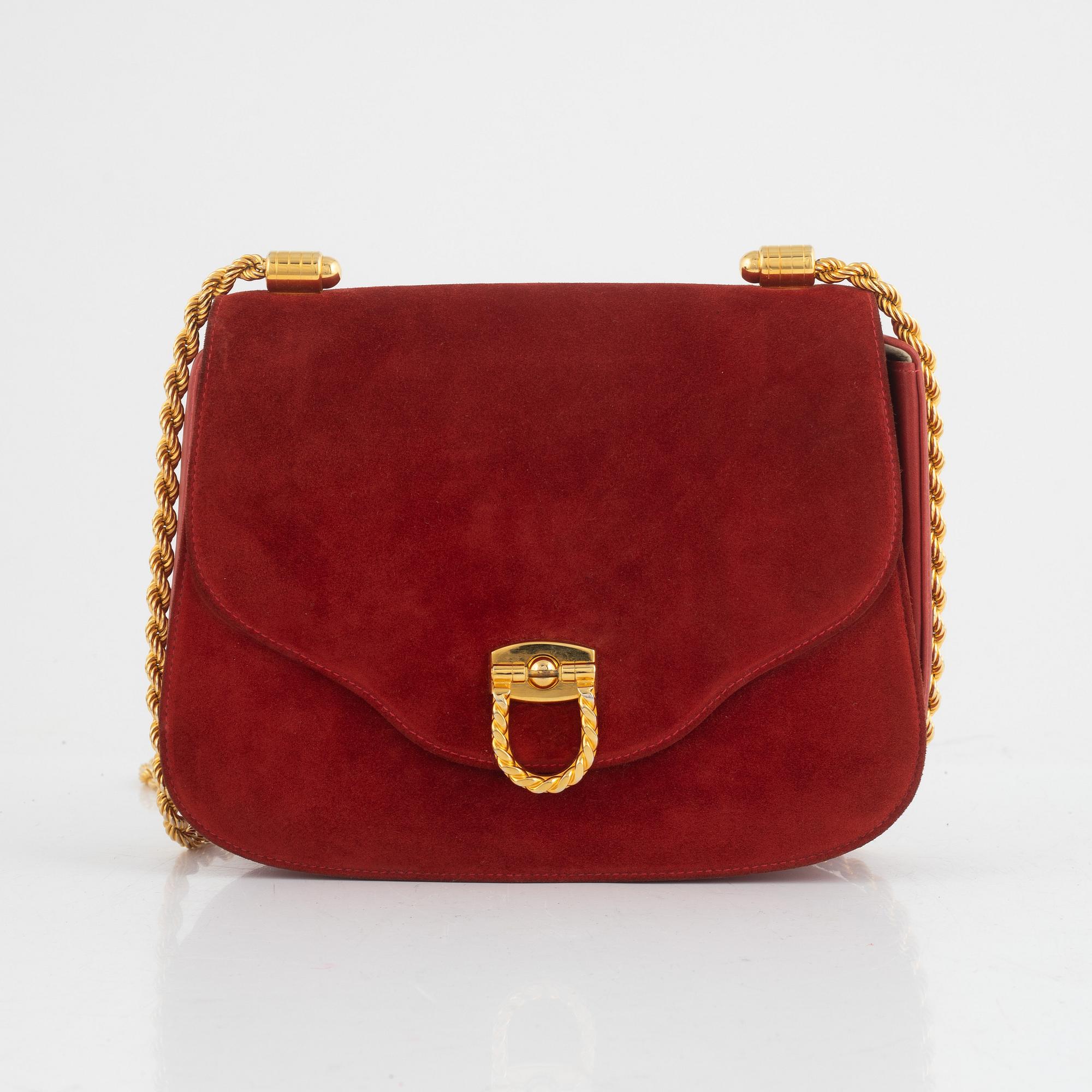 Gucci, a vintage suede bag.