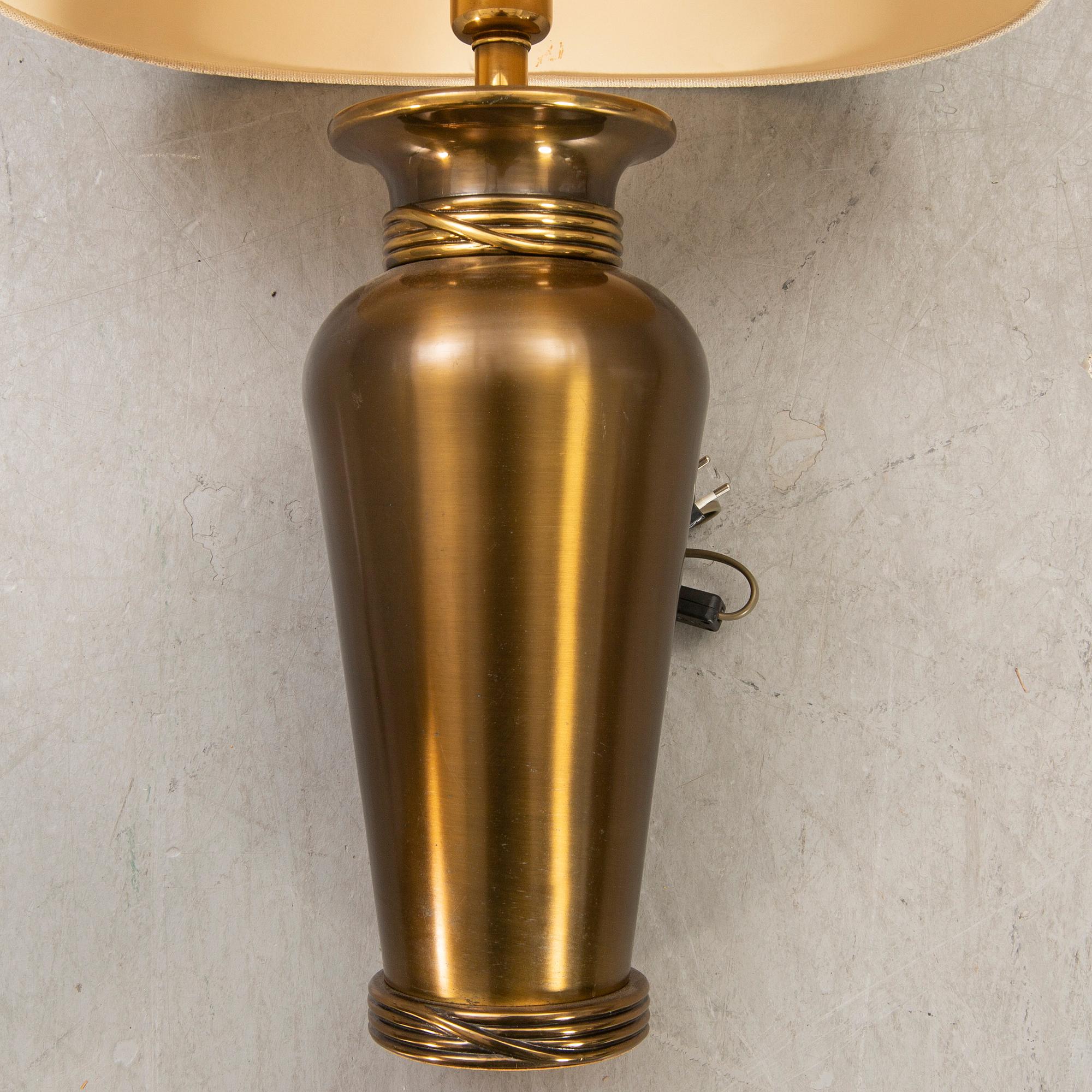 A pair of Deknut metall table lamps later part of the n20th century.