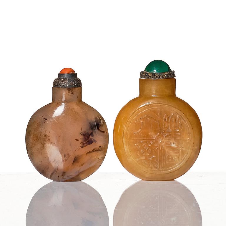 A set of four Chinese snuff bottles and a sculpture, 20th Century.