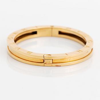 An 18K gold Bulgari bangle.