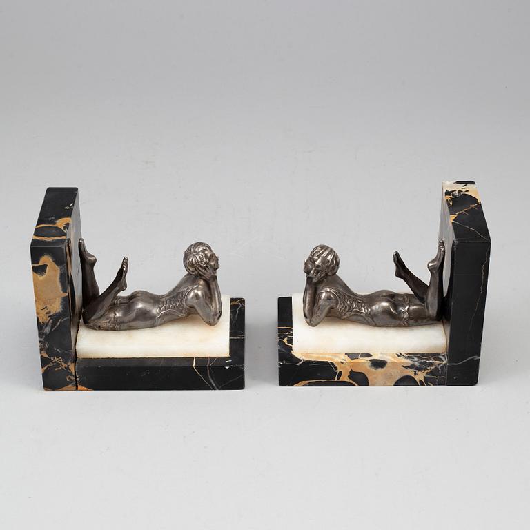 A pair of marble and silver plate art déco book ends.