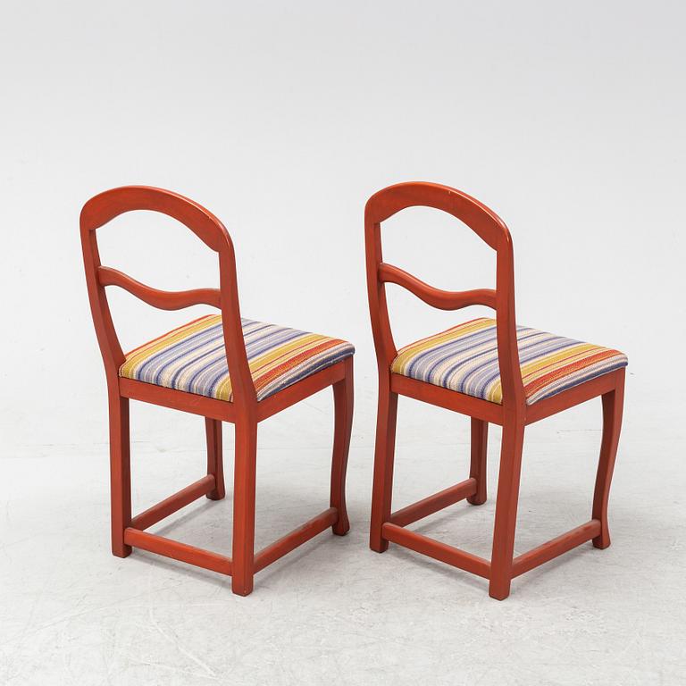 A pair of painted chairs by Carl Malmsten, second half of the 20th Century.