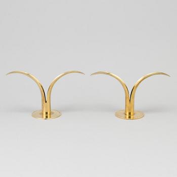 Two pair of 'Liljan' brass candlesticks by Ivar Ålenius-Björk, Ystad Metall, second part of the 20th century.