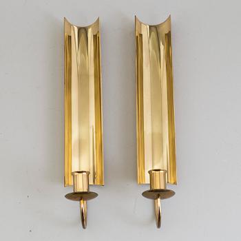 a pair of Pierre Forssell brass wall sconces, Skultuna.