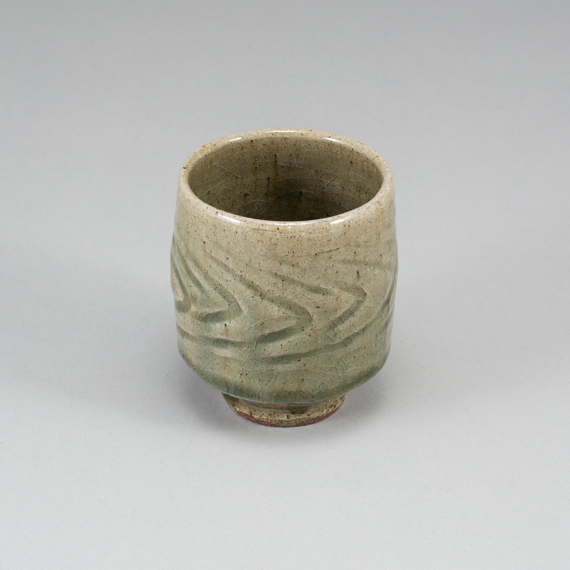 TATSUZŌ SHIMAOKA, a celadon glaze vase, signed.